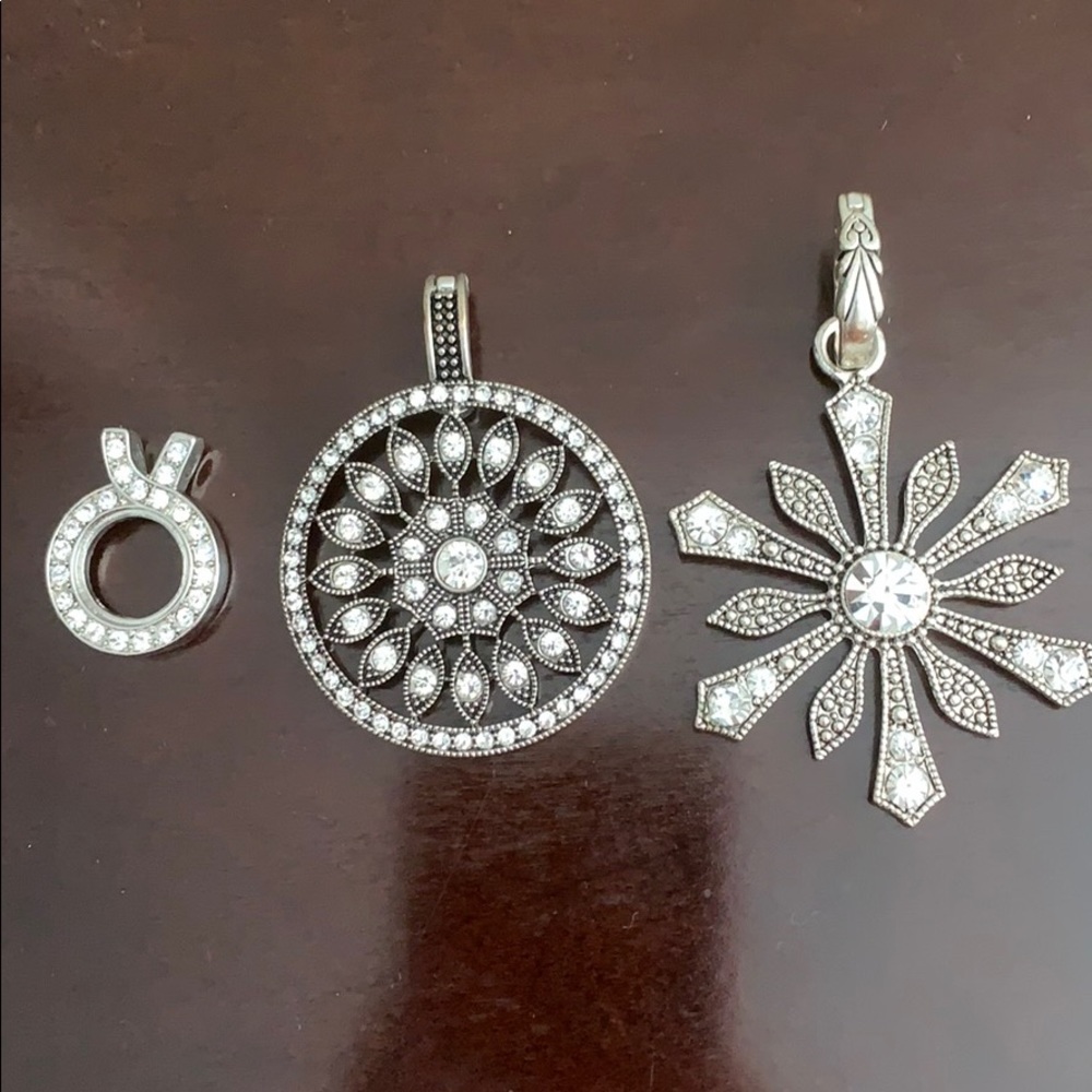 3 silver colored rhinestone pendants